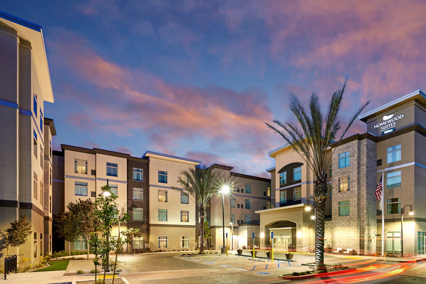 Homewood Suites by Hilton Los Angeles Redondo Beach exterior at dusk on Marine Avenue